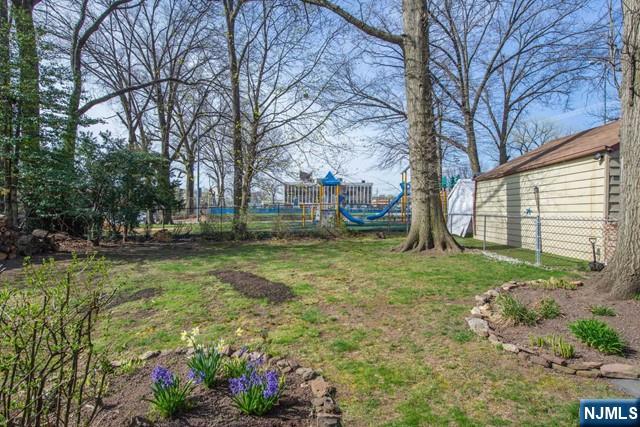153 Madison Avenue Rochelle Park, NJ 07662 - Photo 8 of 26 a view of a backyard with large tree