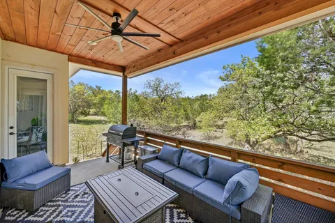 a view of sitting area with furniture and wooden floor