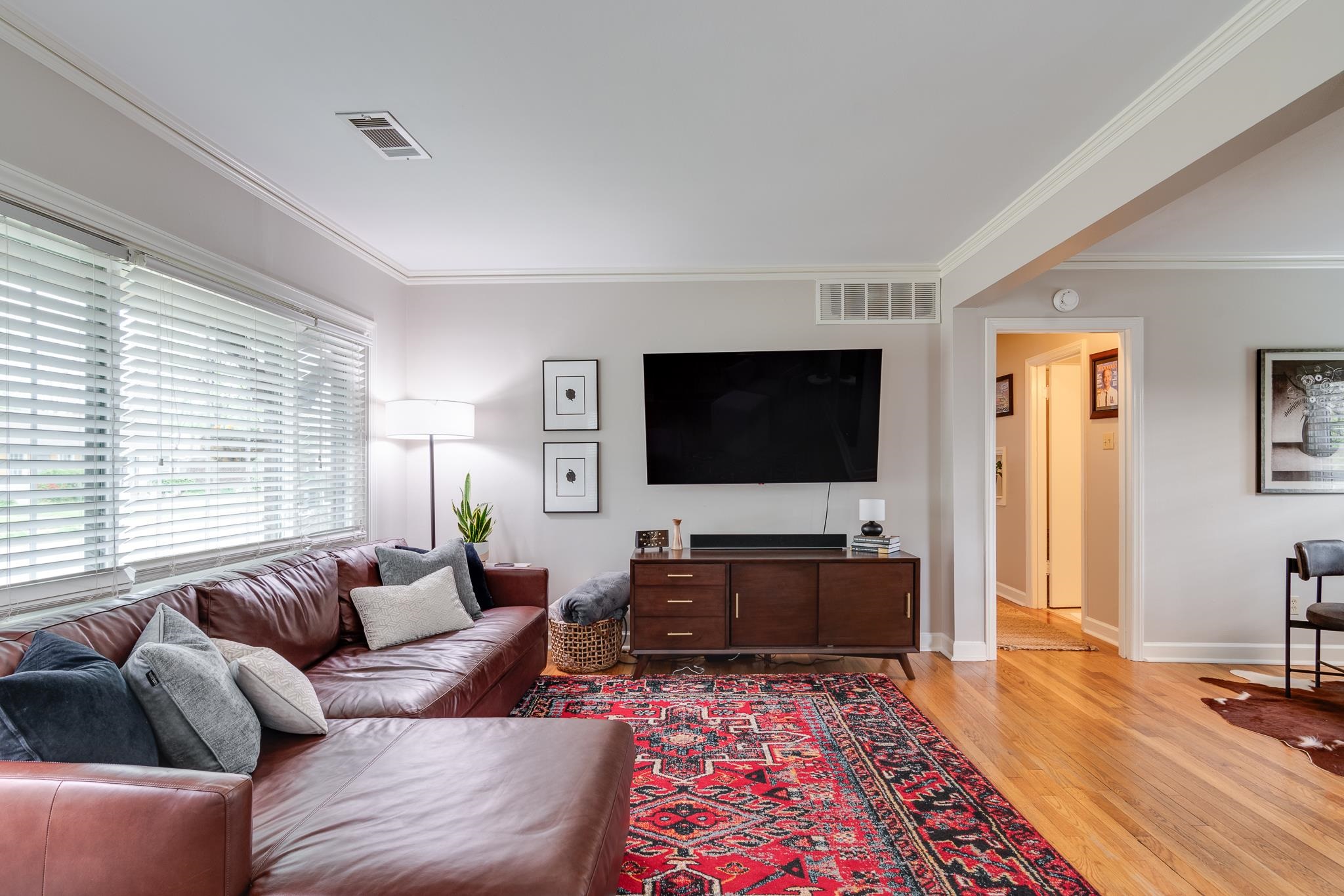4989 Princeton Road Memphis, TN 38117 - Photo 5 of 39 a living room with furniture and a flat screen tv