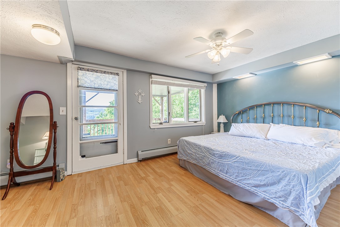 198 East Lake Road Middlesex, NY 14544 - Photo 27 of 50 SPACIOUS BEDROOM WITH ACCESS TO LOWER LEVEL DECK