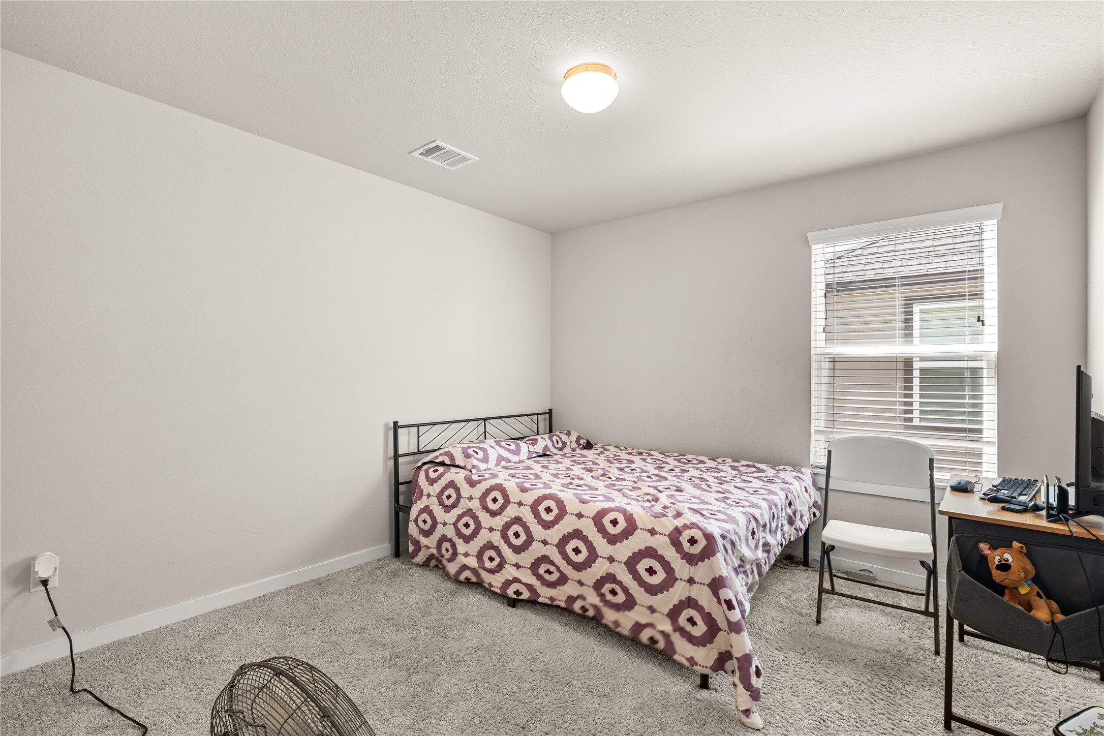 22939 Aspen Vista Dr Spring Spring, TX 77373 - Photo 18 of 29 Comfort meets functionality in this spacious secondary bedroom, offering a well designed layout and plenty of room to personalize the space.