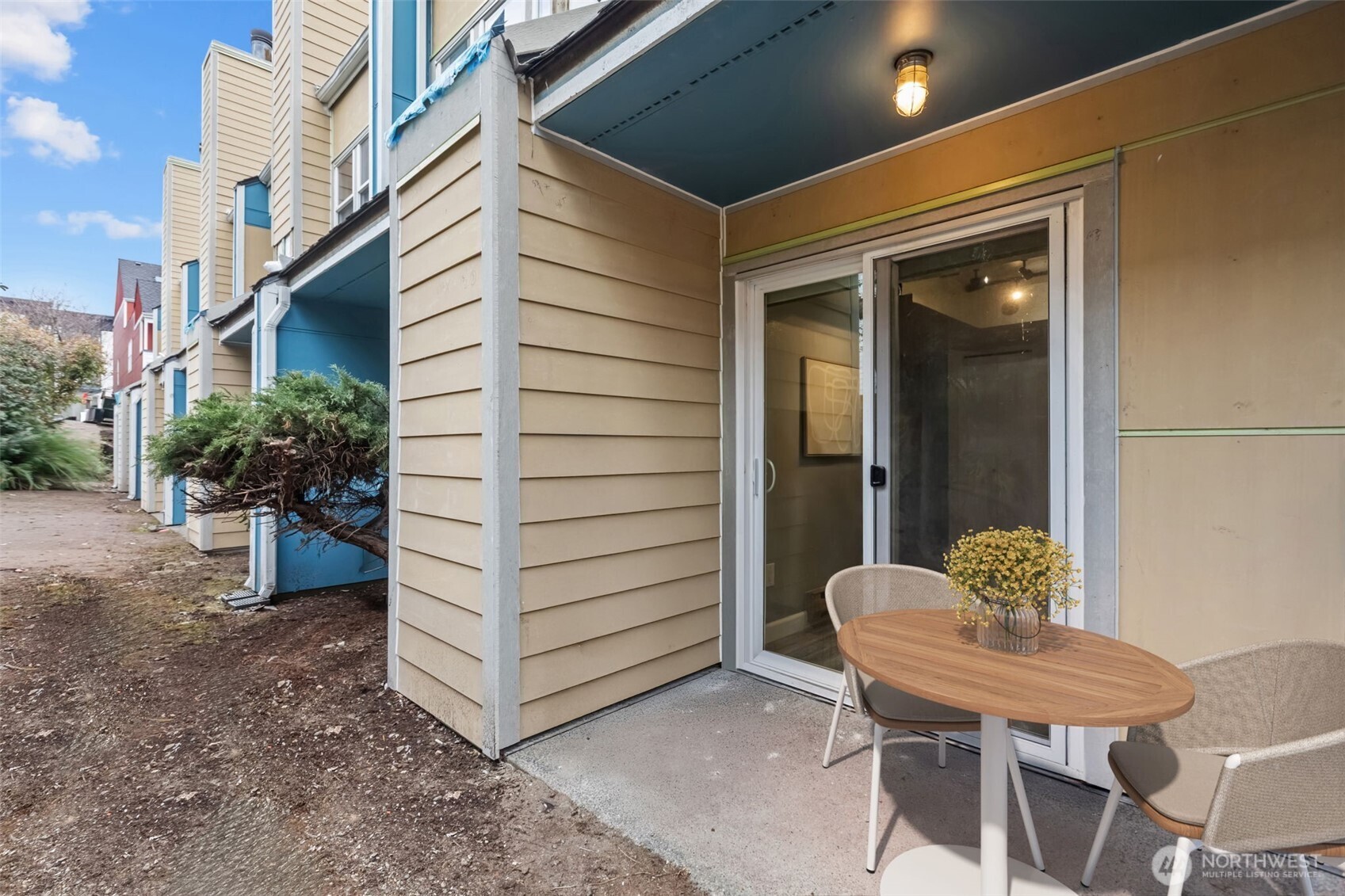 2001 East Yesler Way, Unit 46 Seattle, WA 98122 - Photo 17 of 20 a view of a chair and table in the patio