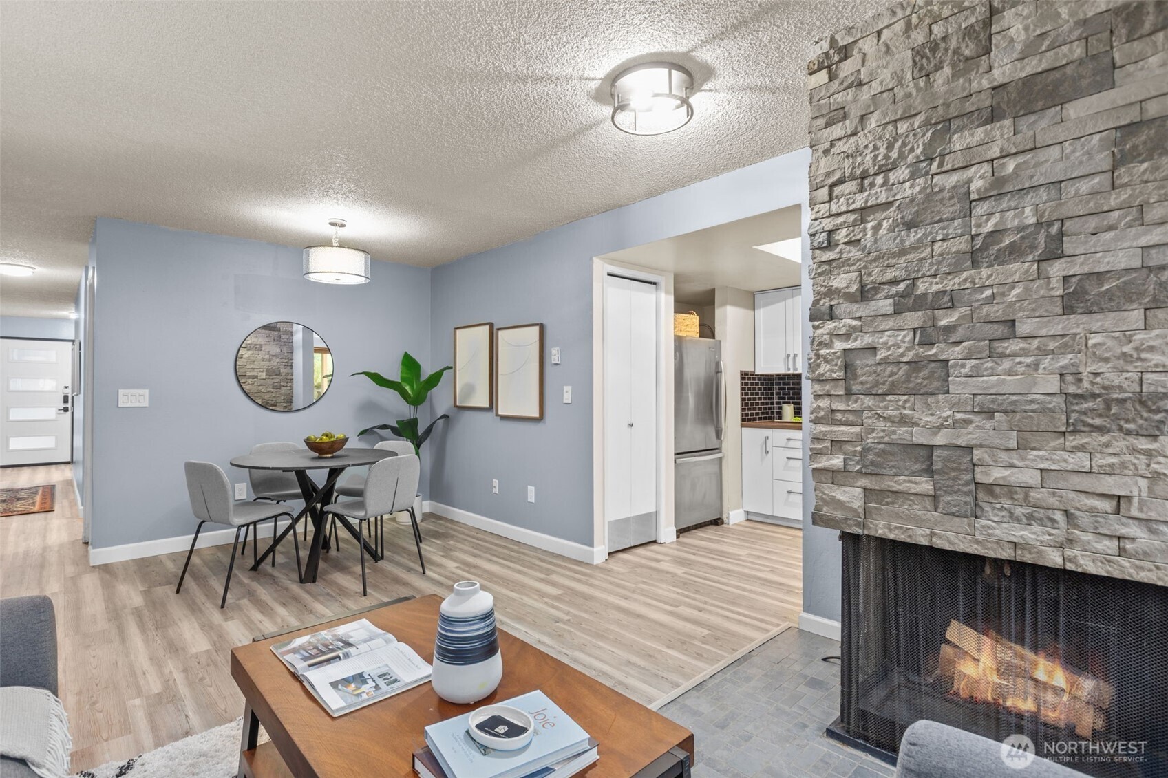 2001 East Yesler Way, Unit 46 Seattle, WA 98122 - Photo 4 of 20 a living room with furniture and a fireplace