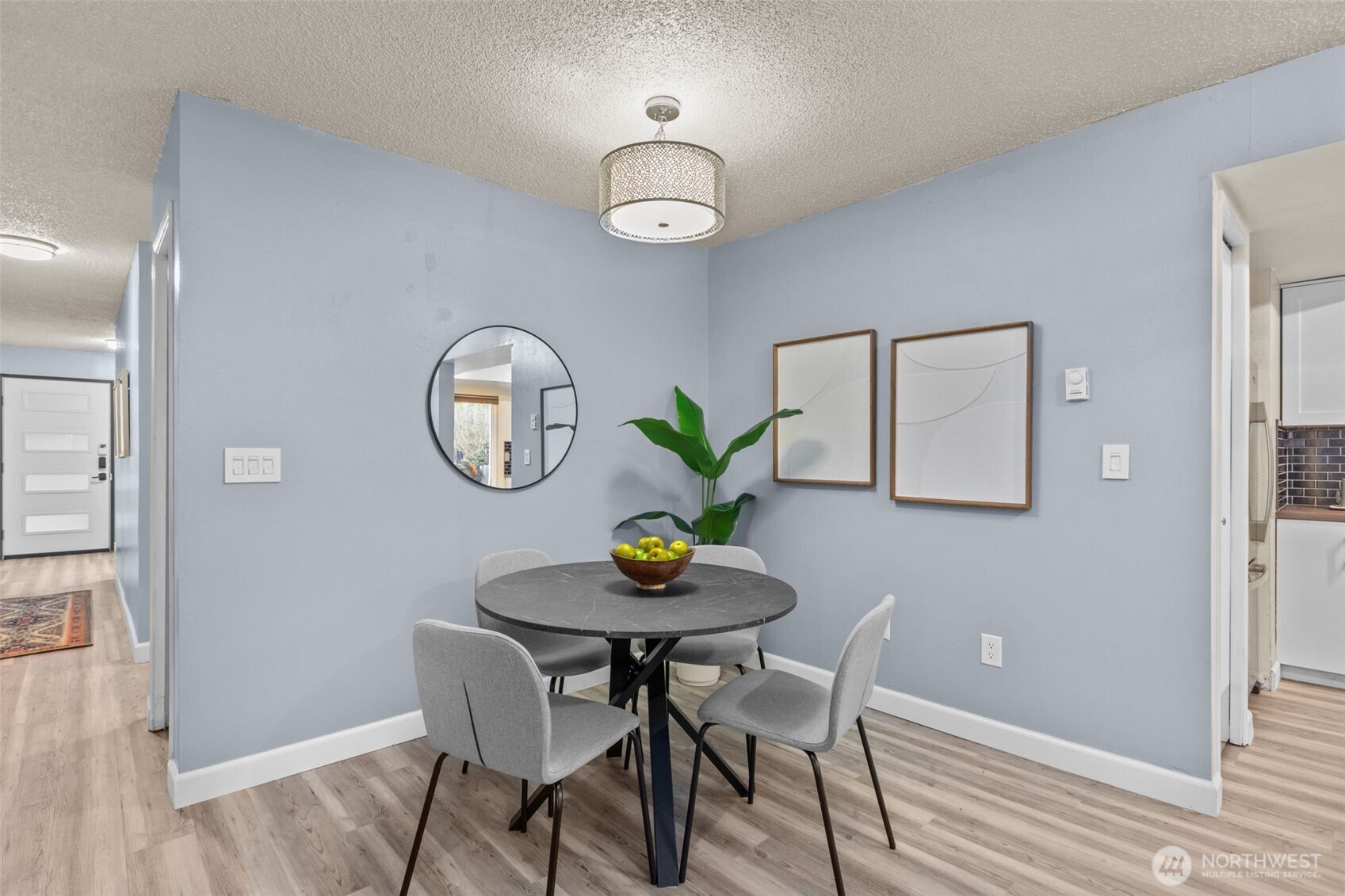 2001 East Yesler Way, Unit 46 Seattle, WA 98122 - Photo 5 of 20 a view of a dining room with furniture and wooden floor