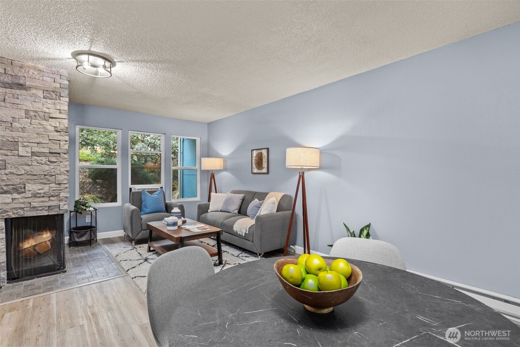 2001 East Yesler Way, Unit 46 Seattle, WA 98122 - Photo 6 of 20 a living room with furniture and a fireplace