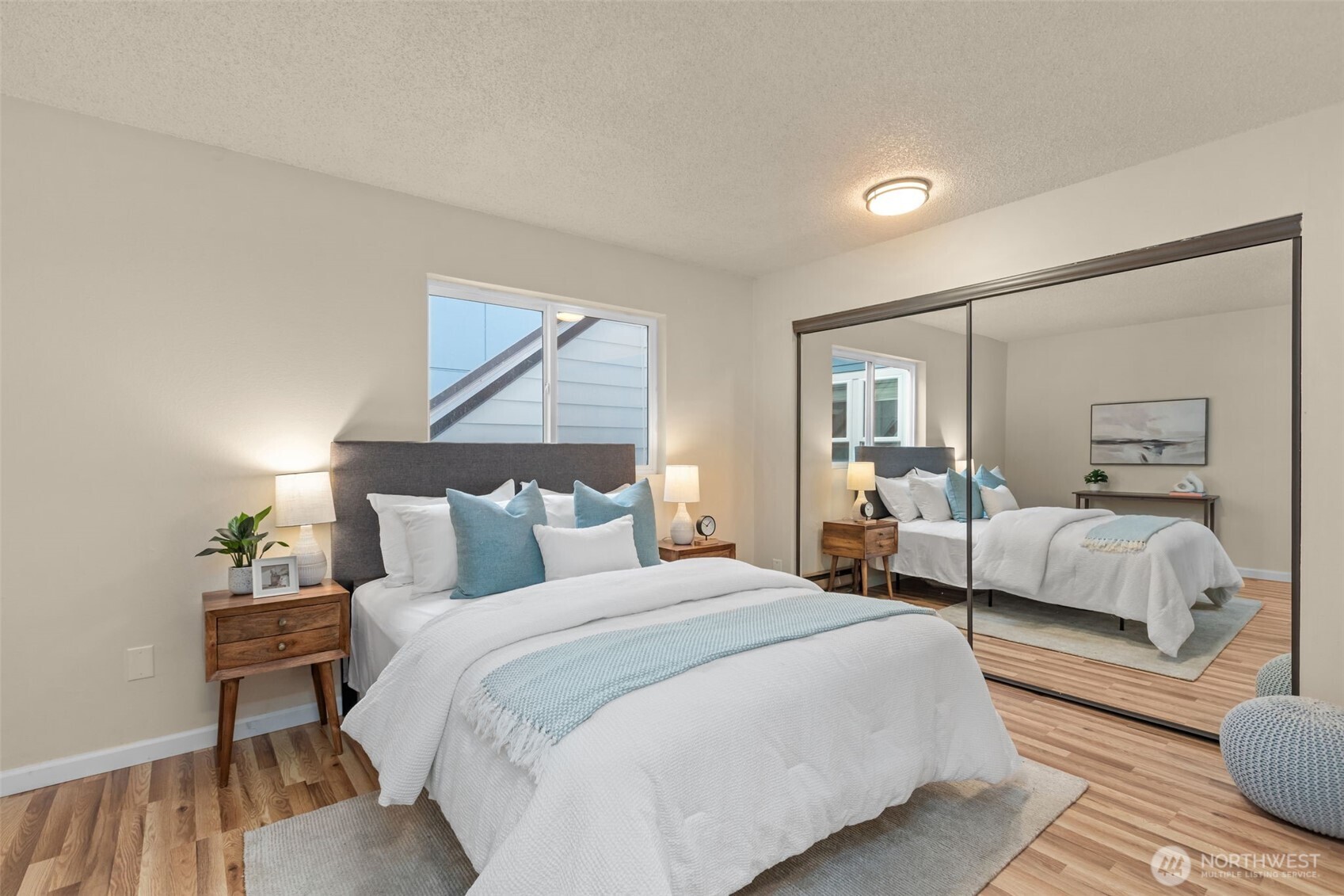 2001 East Yesler Way, Unit 46 Seattle, WA 98122 - Photo 10 of 20 a bedroom with bed and a night stand