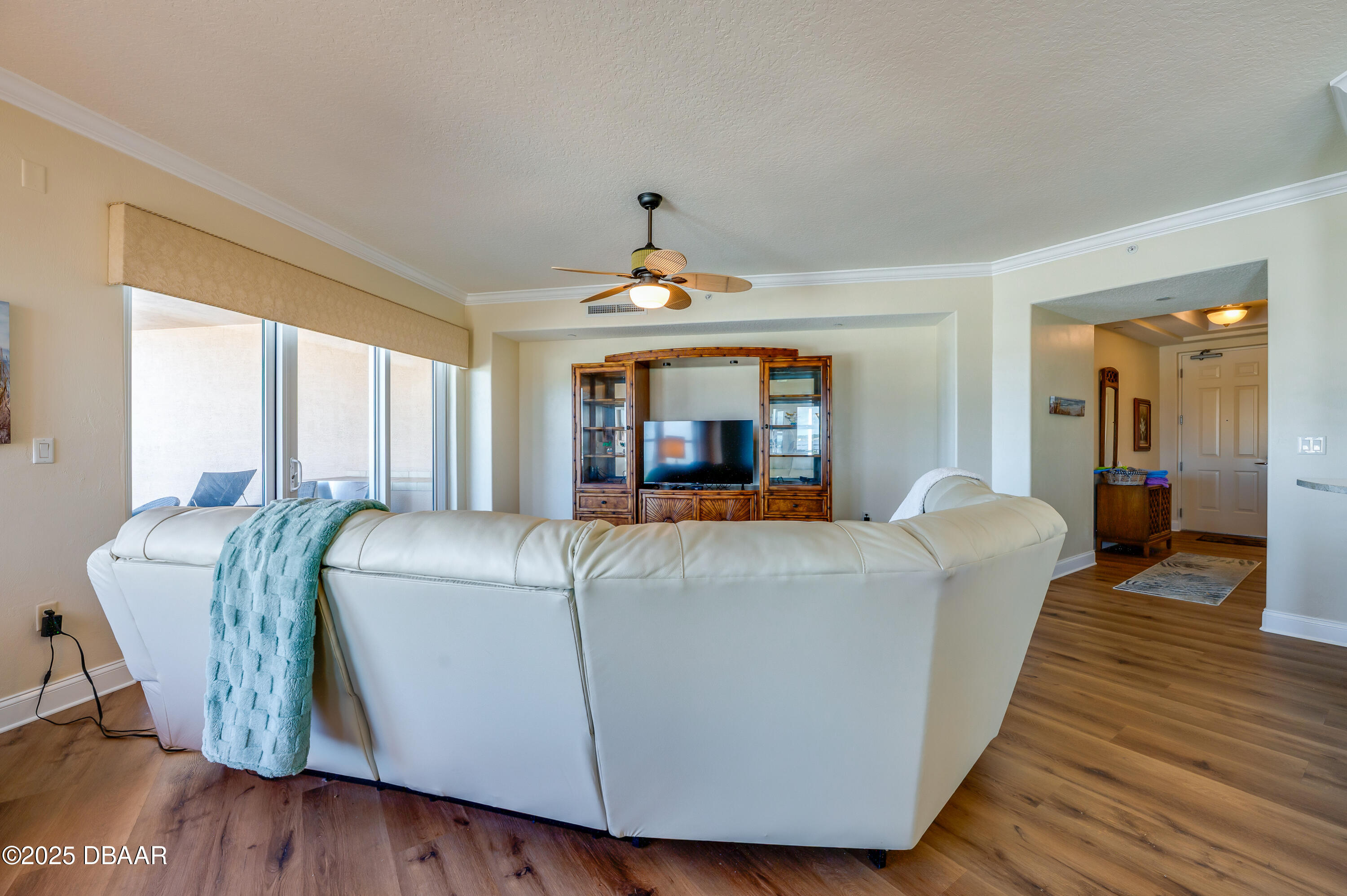 3245 South Atlantic Avenue, Unit 601 Daytona Beach, FL 32118 - Photo 15 of 48 a living room with furniture and a large window