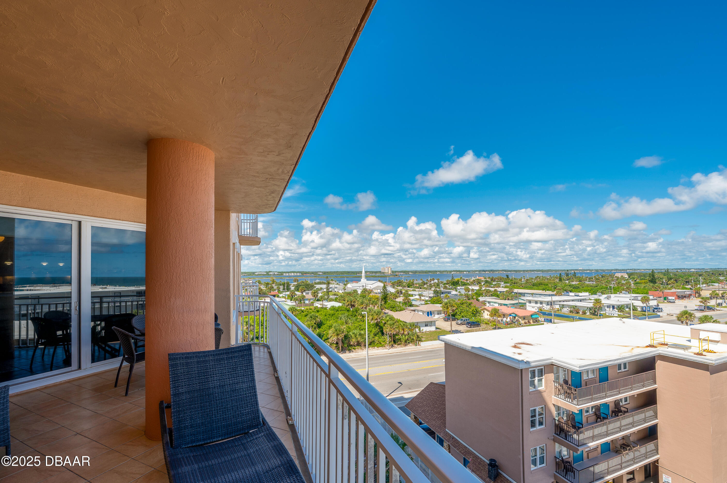 3245 South Atlantic Avenue, Unit 601 Daytona Beach, FL 32118 - Photo 18 of 48 a view of a balcony with furniture