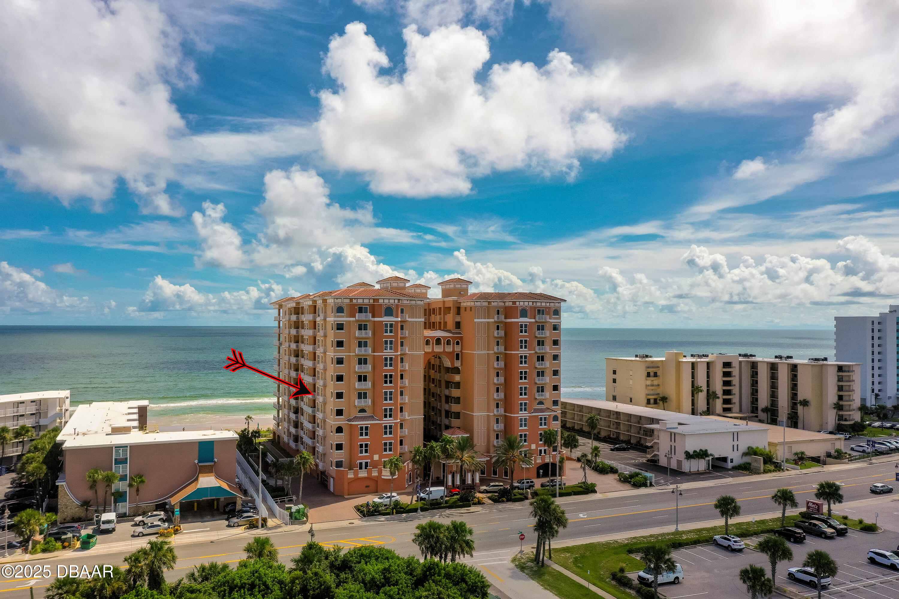 3245 South Atlantic Avenue, Unit 601 Daytona Beach, FL 32118 - Photo 2 of 48 a view of building with lot of car parked windows