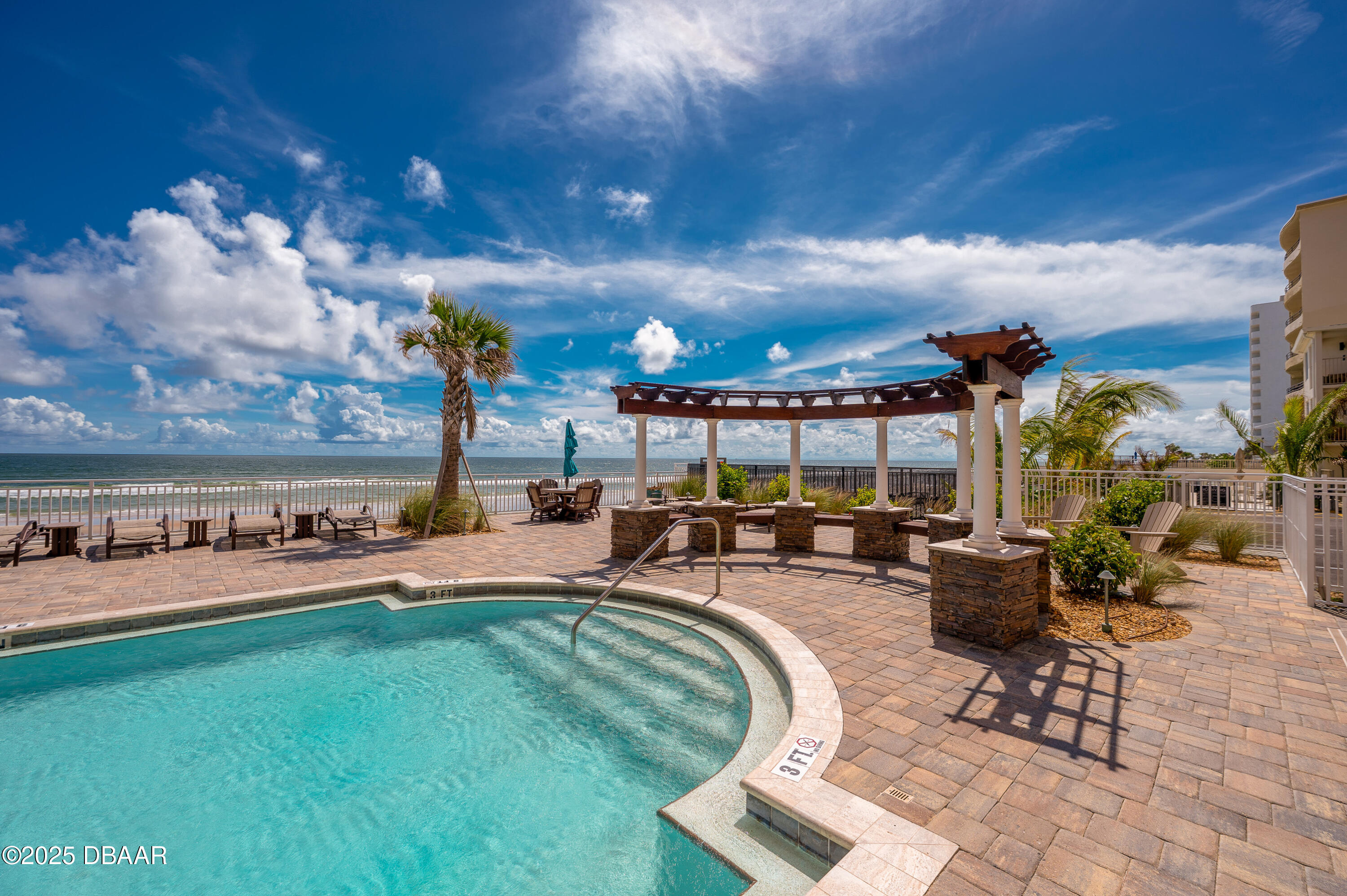 3245 South Atlantic Avenue, Unit 601 Daytona Beach, FL 32118 - Photo 34 of 48 a view of a chairs and tables in the patio