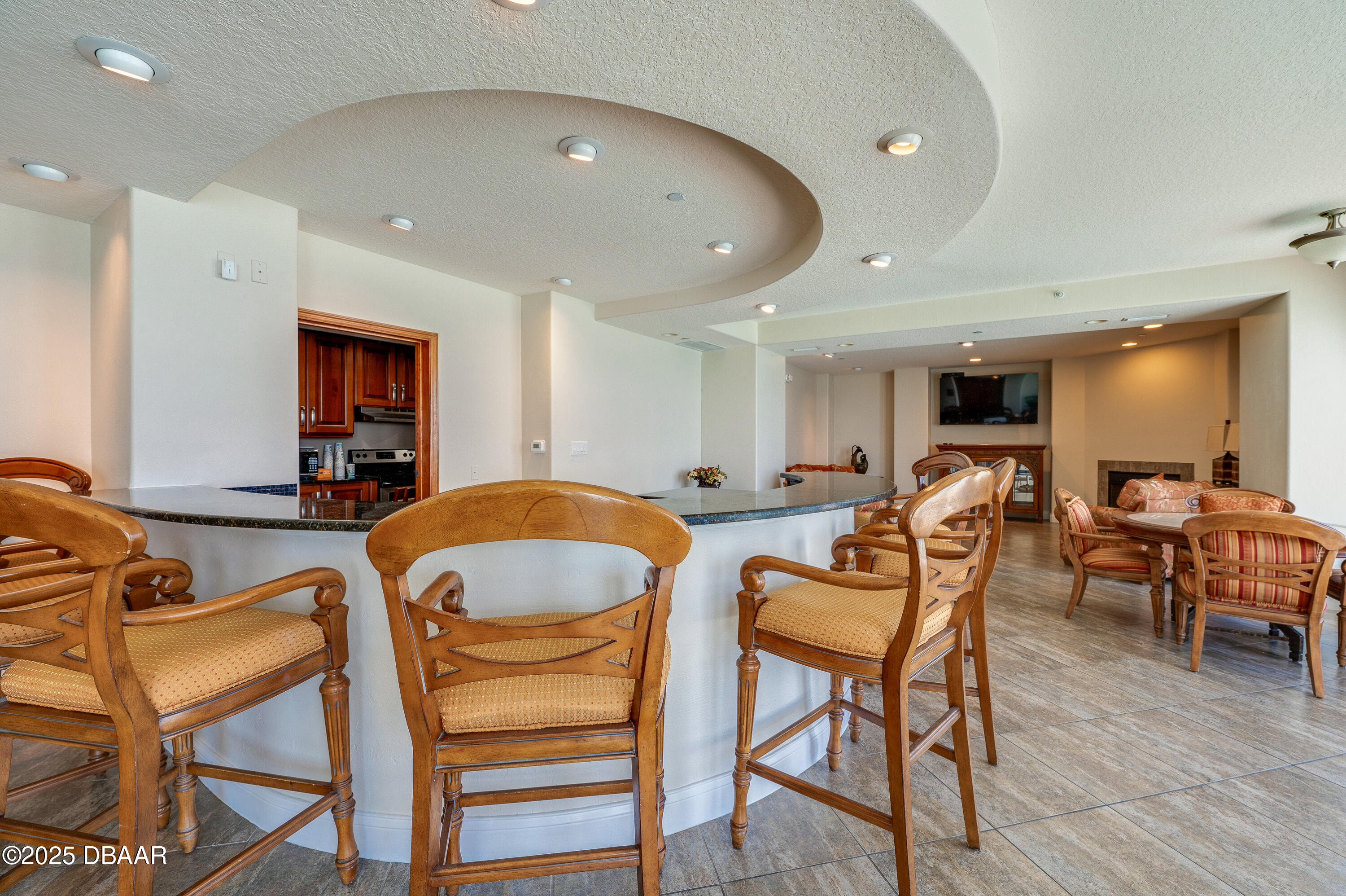 3245 South Atlantic Avenue, Unit 601 Daytona Beach, FL 32118 - Photo 39 of 48 a living room with furniture a wooden floor and a sink