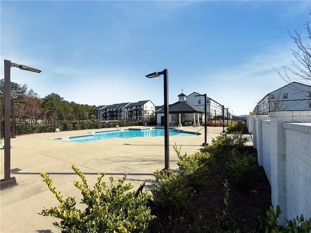 a view of a street with a yard