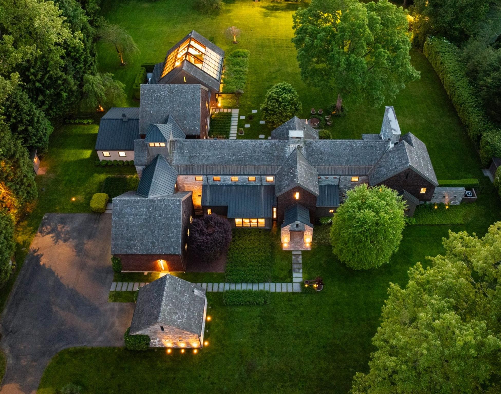 an aerial view of a house with a garden