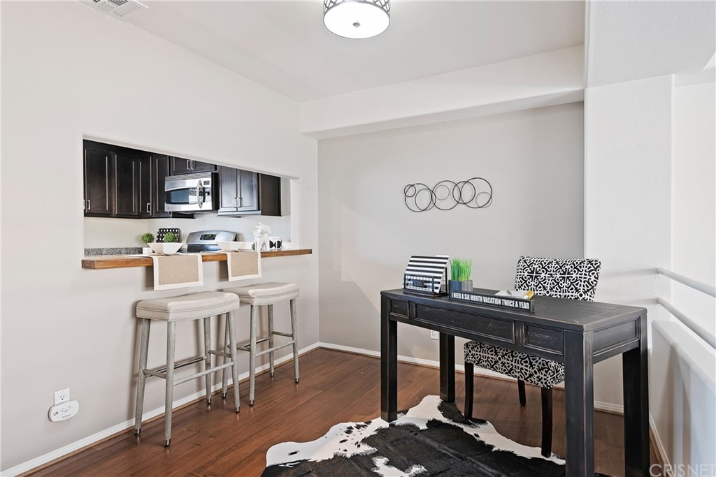 4341 Freedom Drive, Unit B Calabasas, CA 91302 - Photo 8 of 20 a kitchen with stainless steel appliances a stove top oven a sink a dining table and chairs