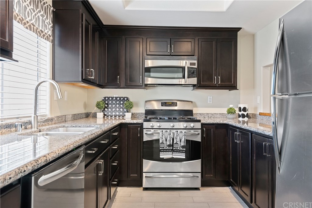 4341 Freedom Drive, Unit B Calabasas, CA 91302 - Photo 9 of 20 a kitchen with stainless steel appliances granite countertop a sink stove and refrigerator