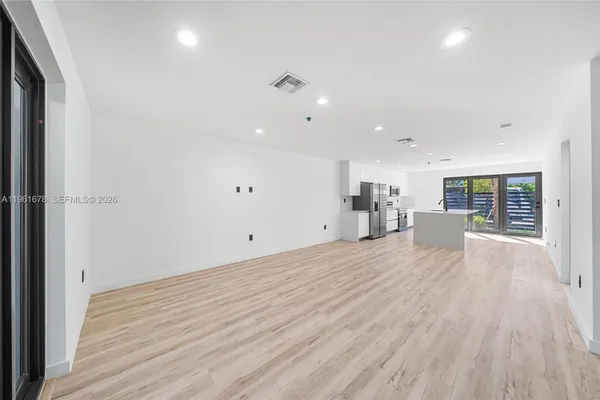 a view of a livingroom with wooden floor