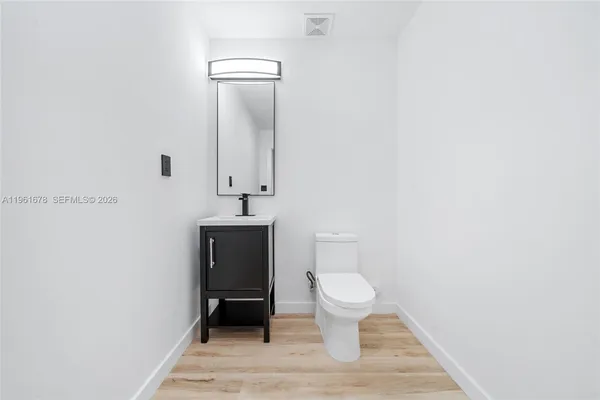 a bathroom with a toilet and a sink