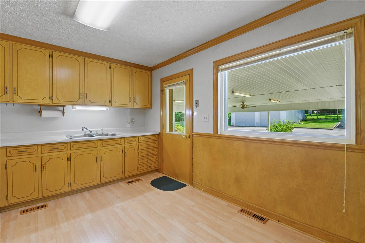 1421 Kelly Road Garner, NC 27529 - Photo 20 of 24 Kitchen view to Carport/patio