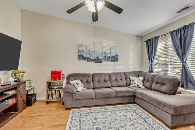 933 South Freedom Boulevard, Unit 7 Provo, UT 84601 - Photo 5 of 23 Living area with light wood finished floors and ceiling fan