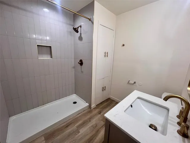 a bathroom with a sink and shower