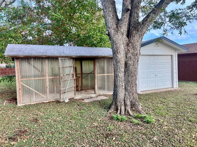 a house with trees in front of it