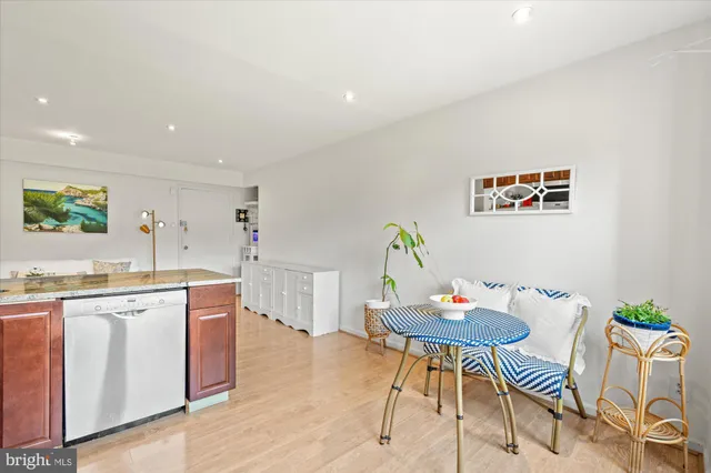 a living room with kitchen island furniture and a wooden floor