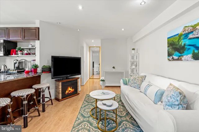 a living room with furniture and a flat screen tv