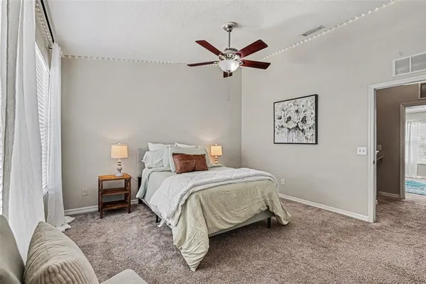 a bedroom with a bed and furniture