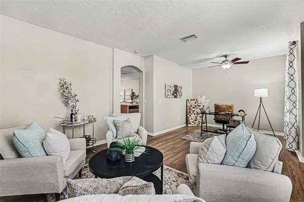 a living room with furniture and a table