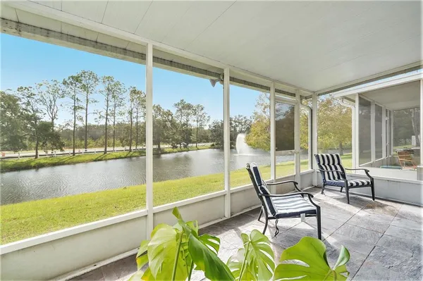 a living room with a large window and a table