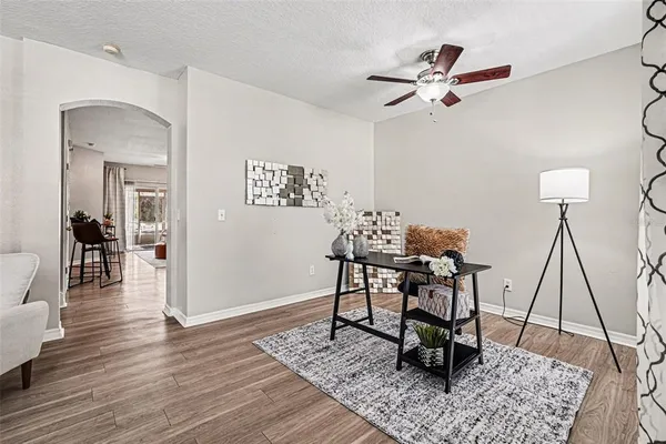 a view of a dining room with furniture and wooden floor
