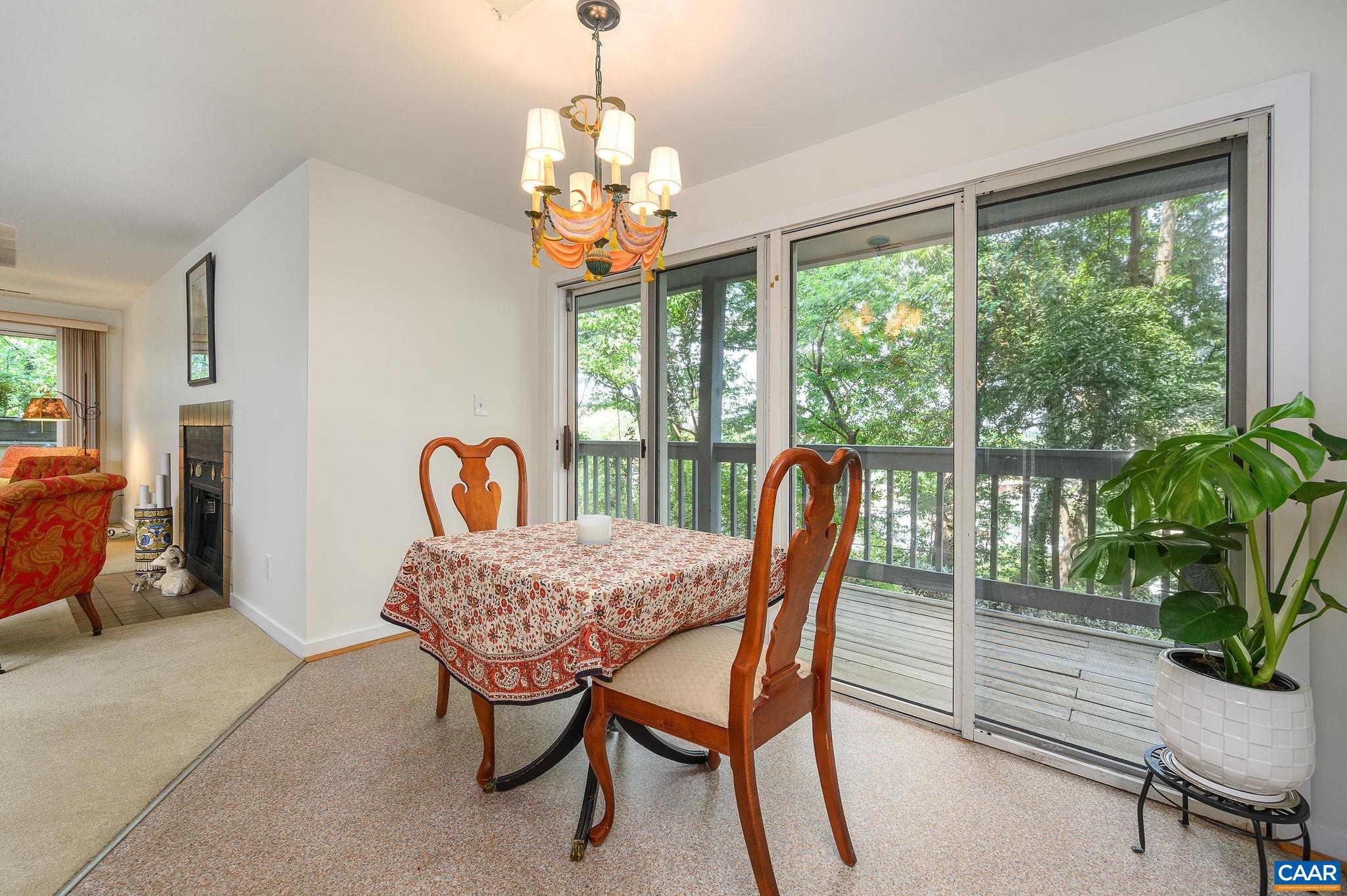 207 2nd Street Northwest, Unit D Charlottesville, VA 22902 - Photo 8 of 18 a view of a dining room with furniture window and outside view