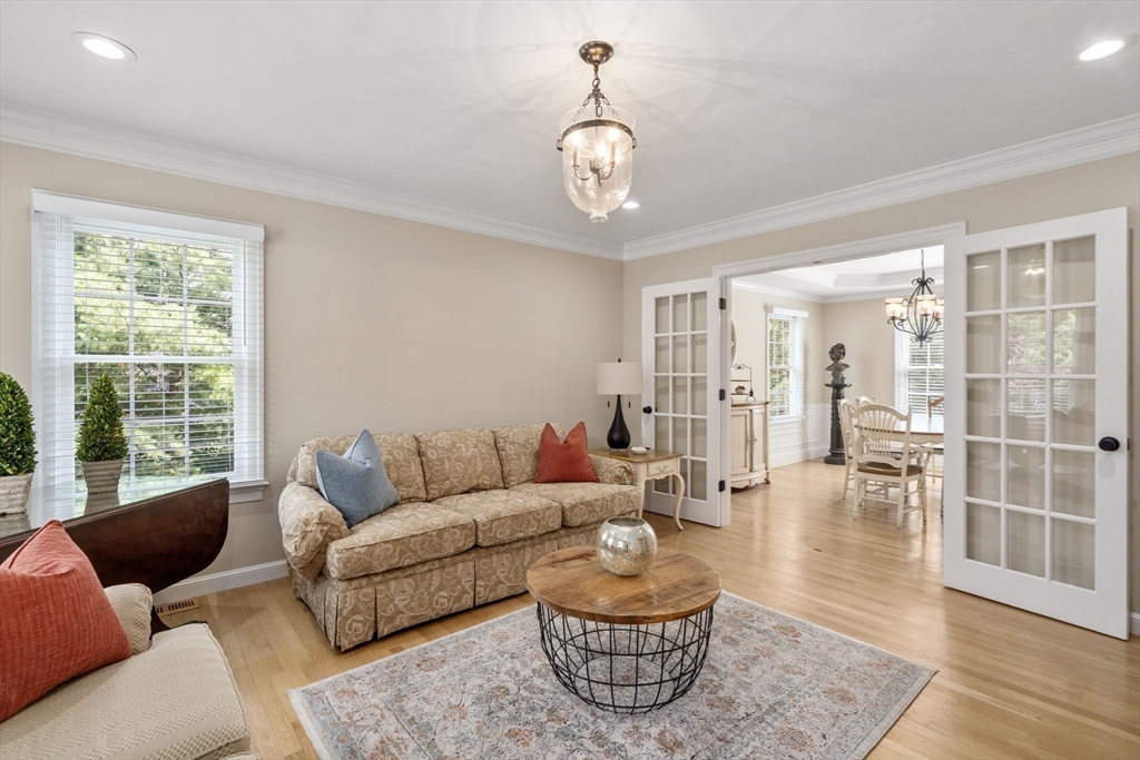 63 High Street Shrewsbury, MA 01545 - Photo 21 of 40 a living room with furniture potted plant and windows