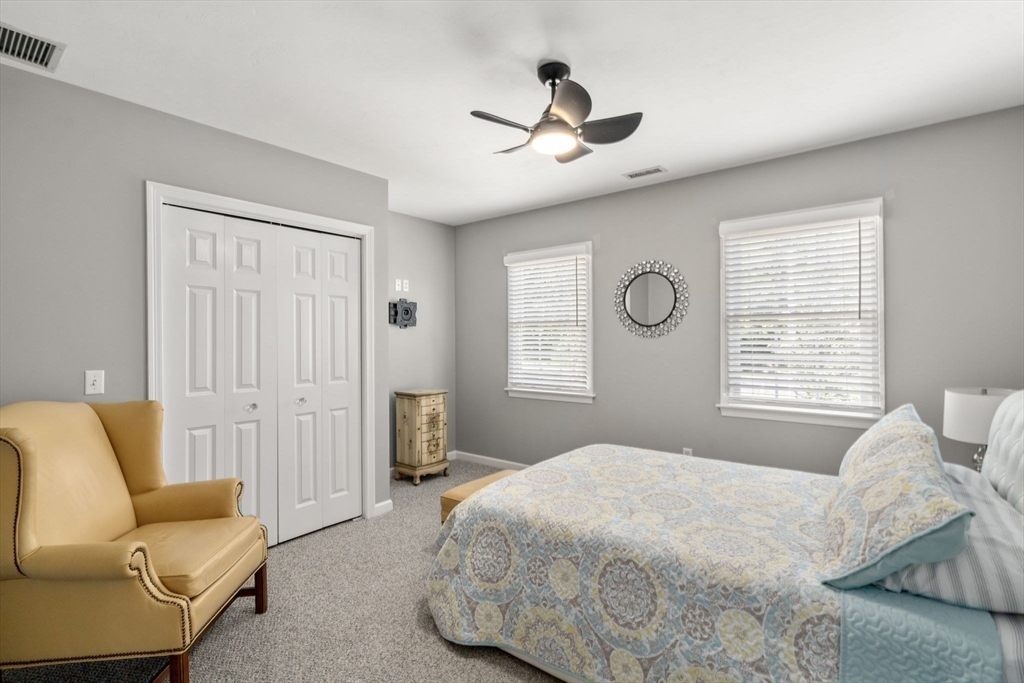 63 High Street Shrewsbury, MA 01545 - Photo 30 of 40 a bedroom with a bed and a couch