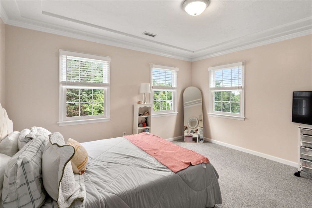 63 High Street Shrewsbury, MA 01545 - Photo 33 of 40 a bedroom with a bed and a window