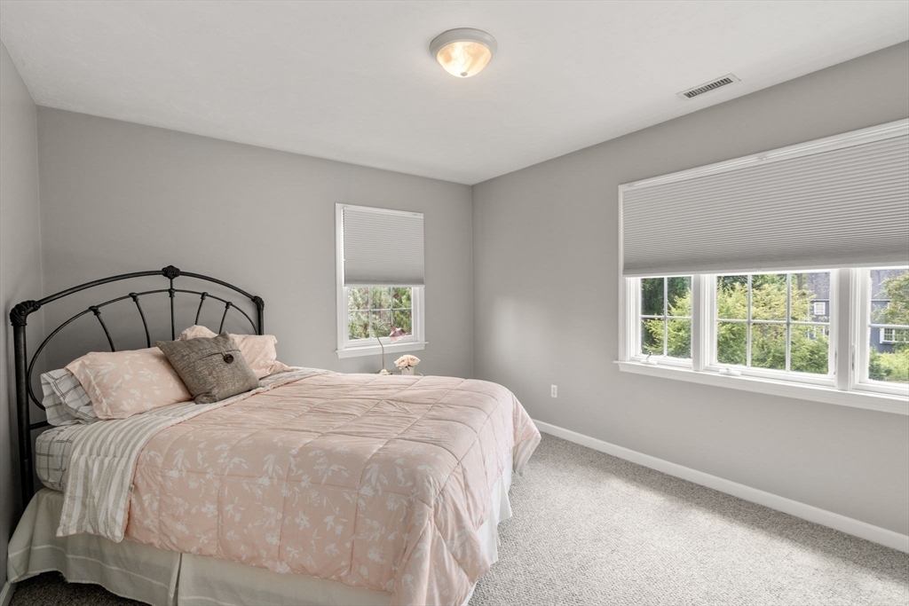 63 High Street Shrewsbury, MA 01545 - Photo 34 of 40 a bedroom with a bed and window