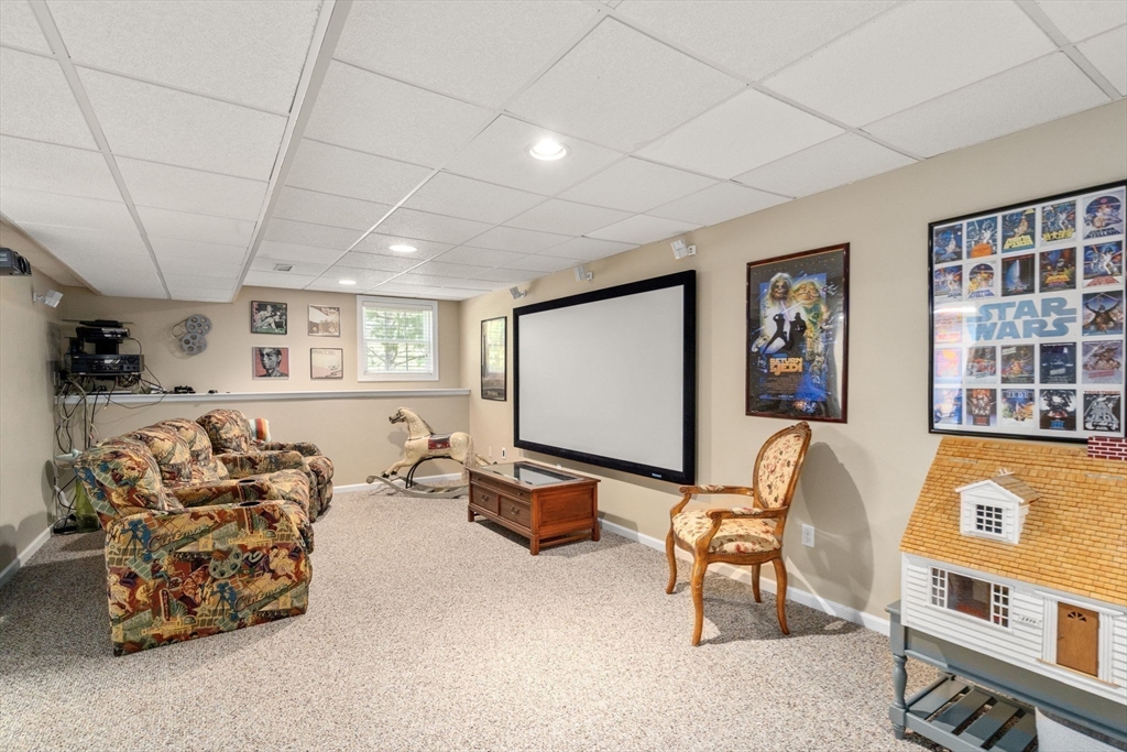 63 High Street Shrewsbury, MA 01545 - Photo 36 of 40 a living room with furniture gym equipment and a window