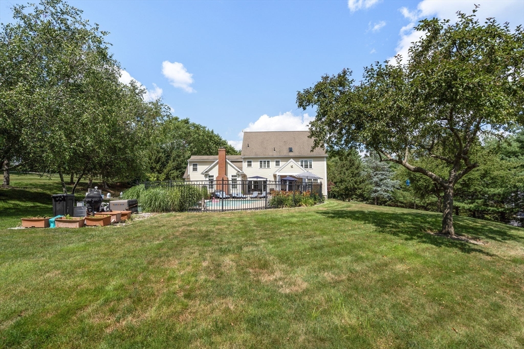63 High Street Shrewsbury, MA 01545 - Photo 38 of 40 a view of a house with backyard porch and sitting area