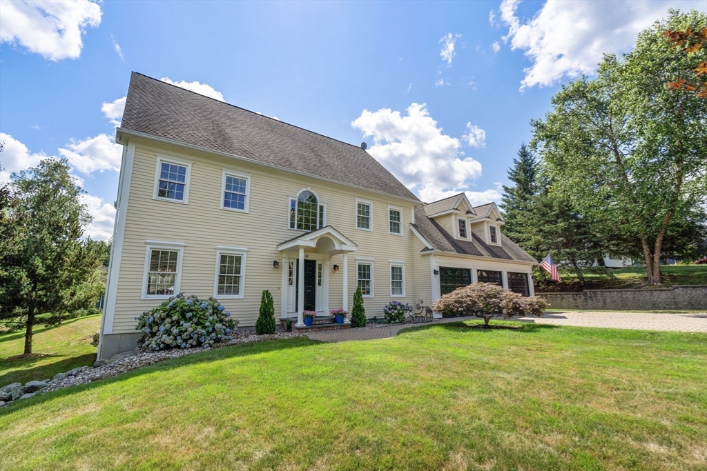 63 High Street Shrewsbury, MA 01545 - Photo 39 of 40 a front view of a house with garden