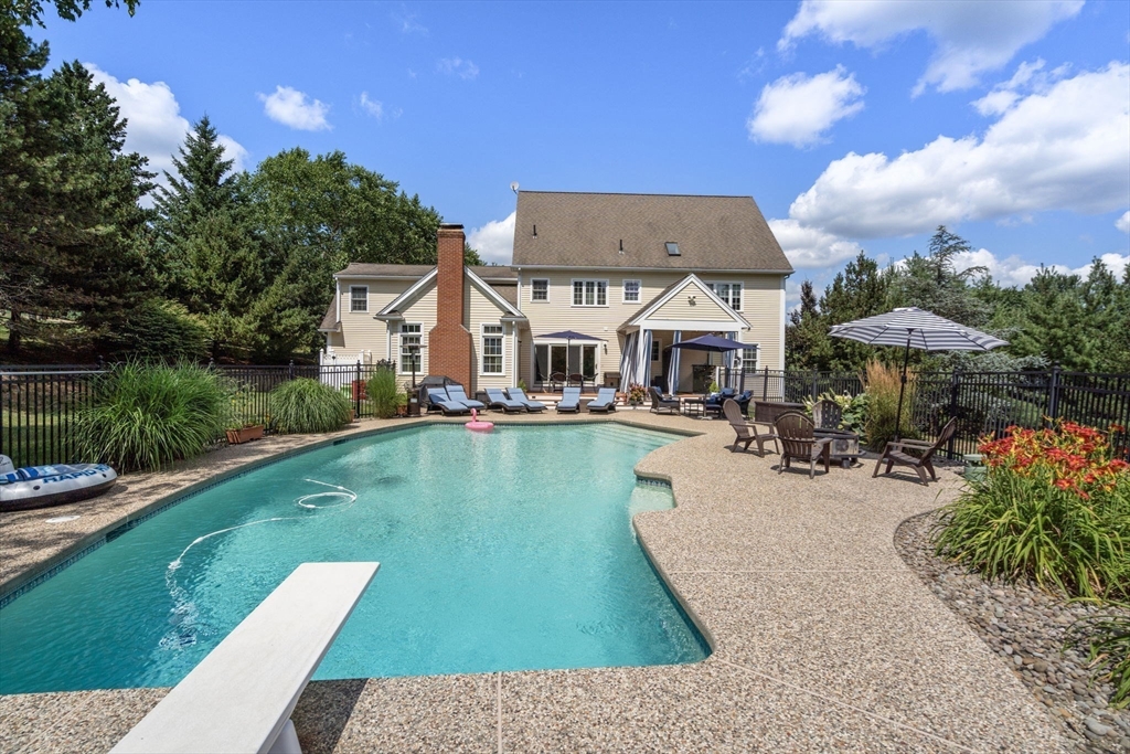 63 High Street Shrewsbury, MA 01545 - Photo 4 of 40 a view of a house with pool porch and chairs