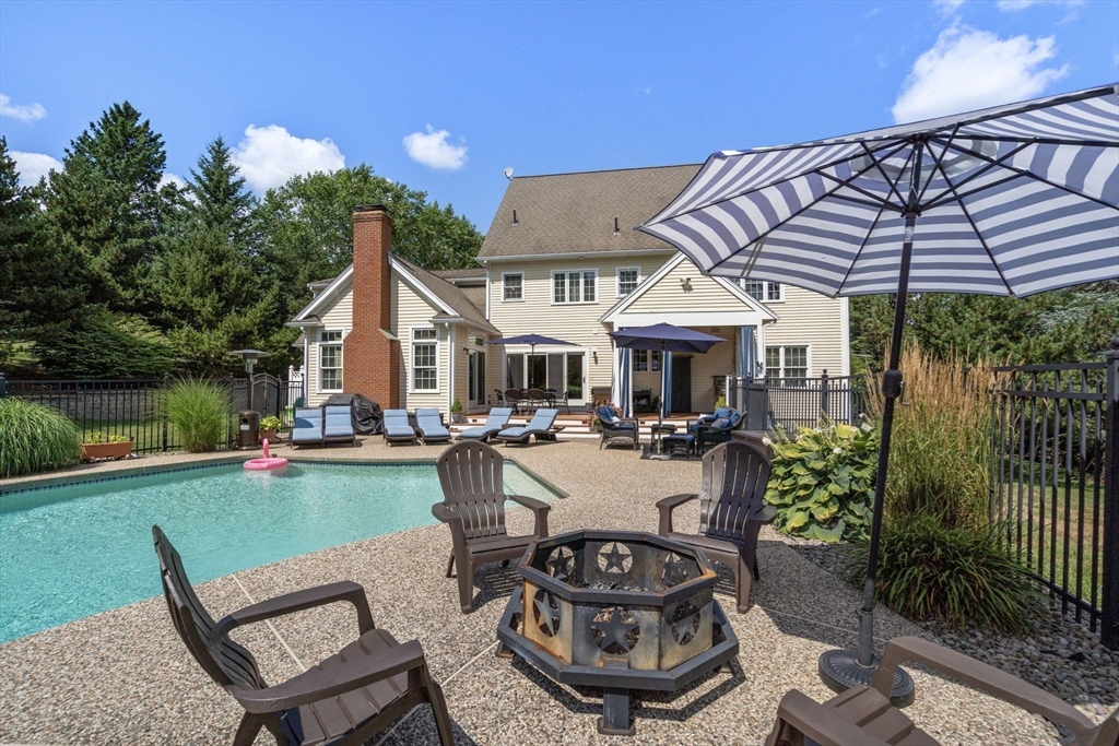 63 High Street Shrewsbury, MA 01545 - Photo 5 of 40 a view of a house with backyard sitting area and garden