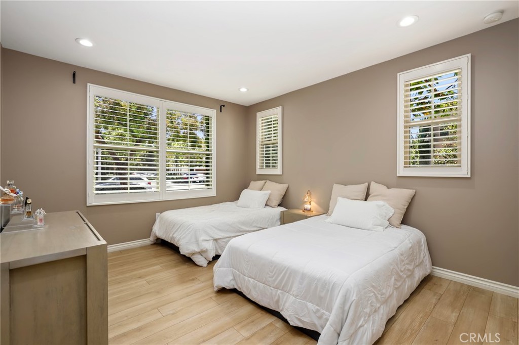 59 Kempton Irvine, CA 92620 - Photo 17 of 29 a bedroom with two beds and wooden floor