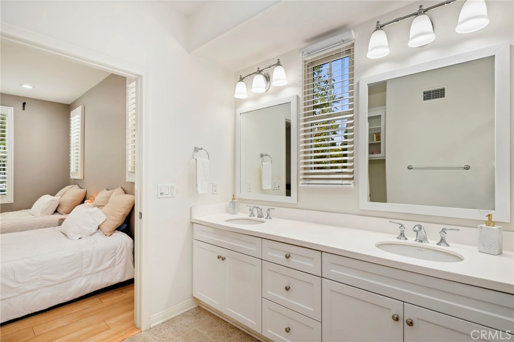59 Kempton Irvine, CA 92620 - Photo 18 of 29 a en suite bathroom with double sink and a mirror