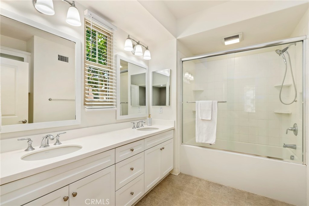 59 Kempton Irvine, CA 92620 - Photo 19 of 29 a bathroom with a granite countertop sink mirror shower and double