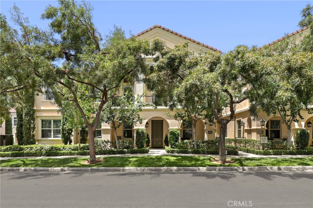 59 Kempton Irvine, CA 92620 - Photo 2 of 29 two white house with a big yard and large trees