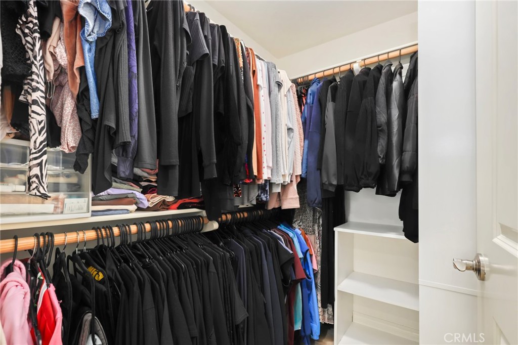 59 Kempton Irvine, CA 92620 - Photo 22 of 29 a view of walk in closet with clothes and shoes