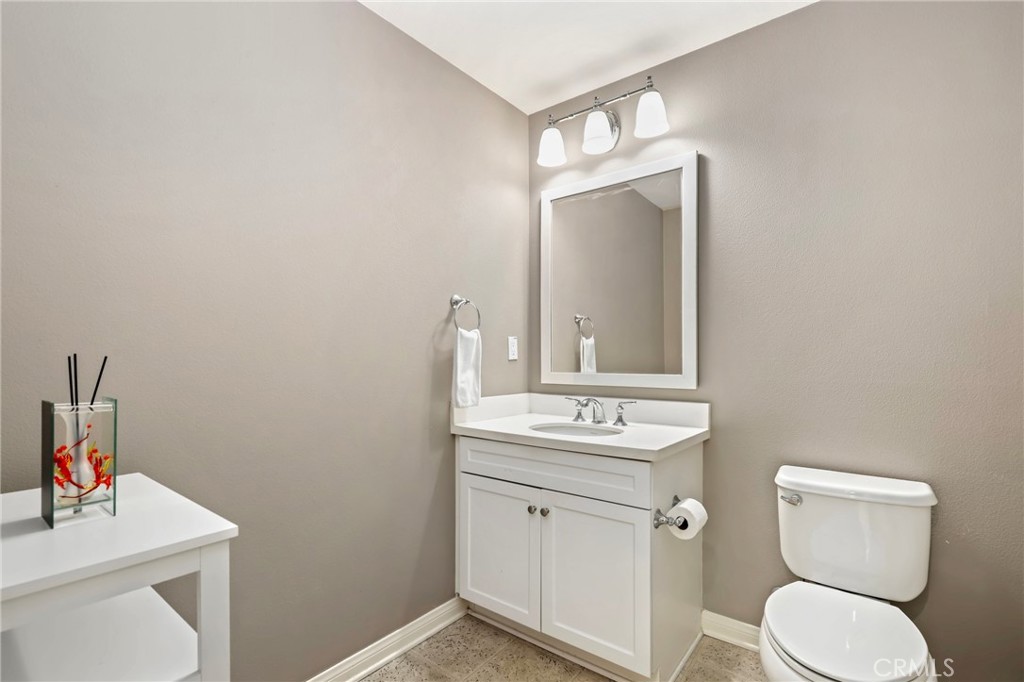 59 Kempton Irvine, CA 92620 - Photo 23 of 29 a bathroom with a toilet sink and mirror