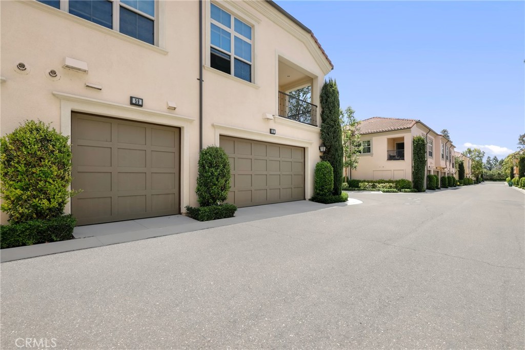 59 Kempton Irvine, CA 92620 - Photo 24 of 29 a front view of a house with a yard and garage