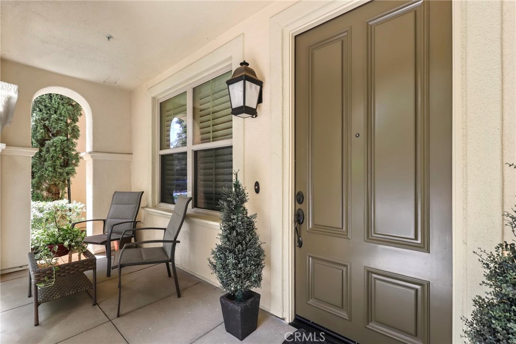 59 Kempton Irvine, CA 92620 - Photo 4 of 29 a balcony with furniture and potted plants