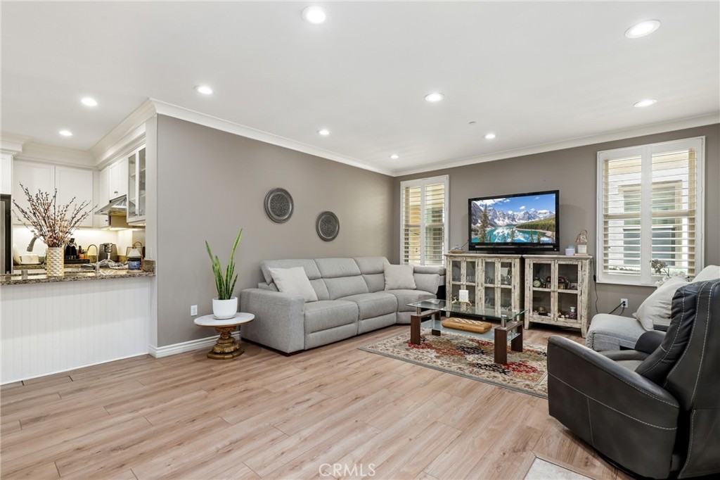 59 Kempton Irvine, CA 92620 - Photo 7 of 29 a living room with furniture and a flat screen tv